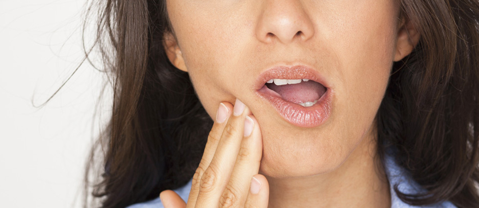 Woman experiencing tooth pain