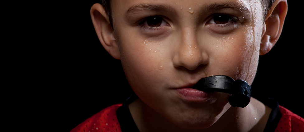 Boy using sports guard